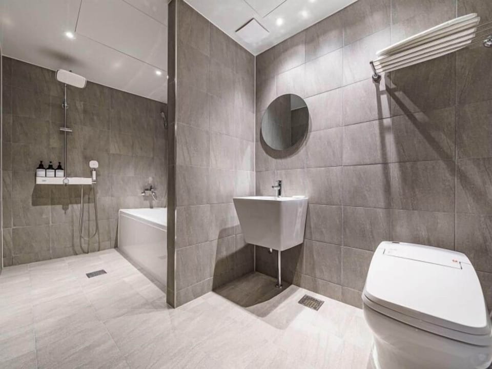 Shower, designer toiletries, hair dryer, bathrobes