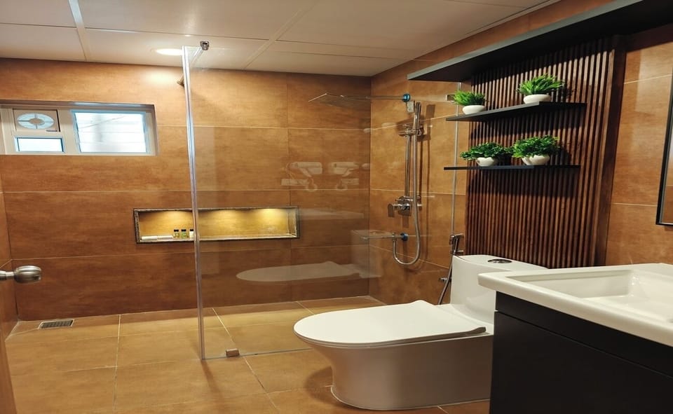 Deluxe Family AC Room | Bathroom | Shower, rainfall showerhead, designer toiletries, hair dryer