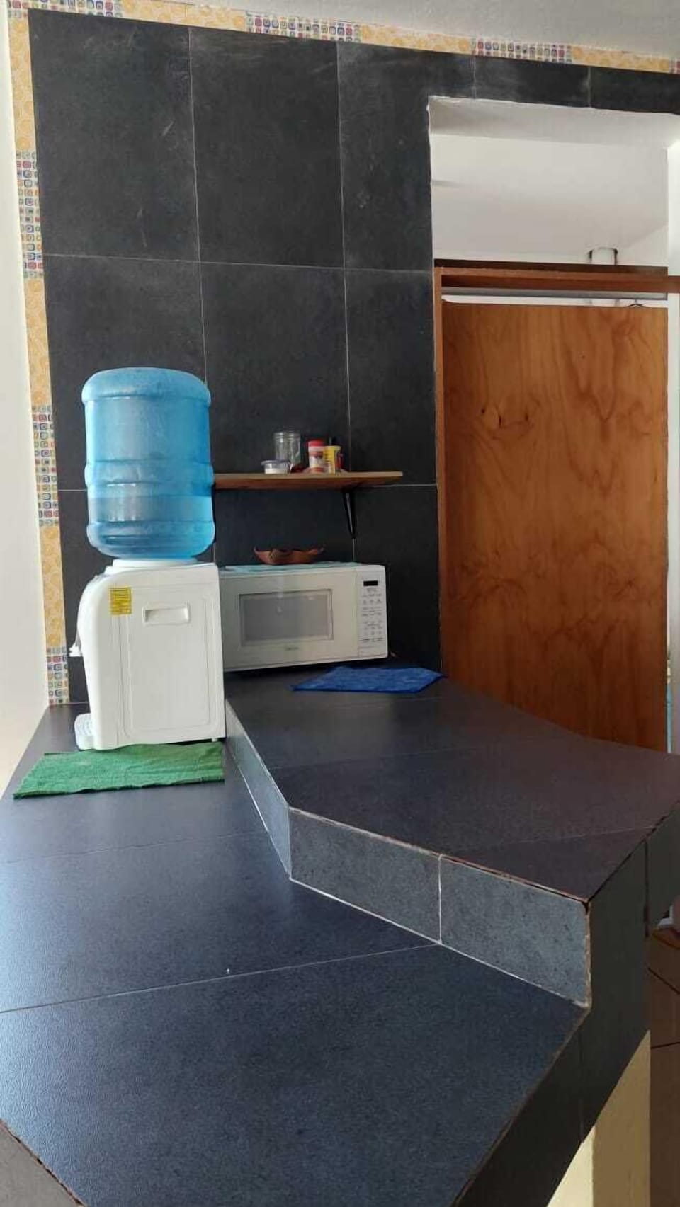 Full-size fridge, blender, cleaning supplies