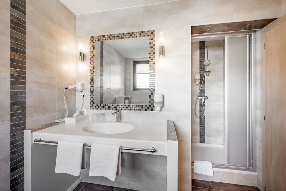 Double Room | Bathroom | Shower, hair dryer, towels, soap