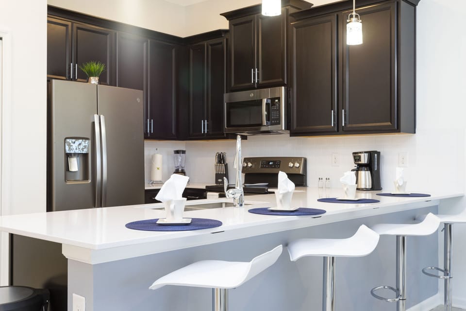 Family Townhome, 2 Bedrooms | Private kitchen | Full-size fridge, microwave, oven, stovetop