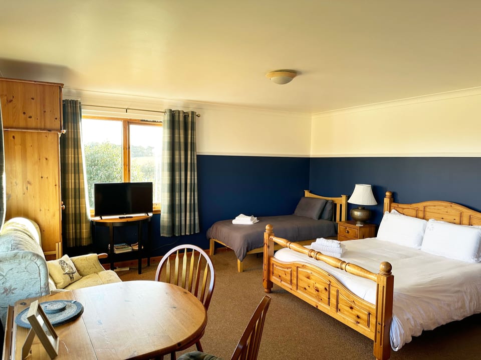 Premium bedding, memory foam beds, desk, laptop workspace