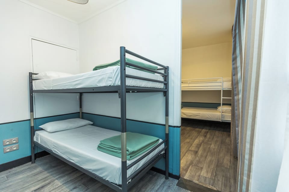 Bed in 8-Bed Dormitory Room | Blackout drapes, iron/ironing board, free WiFi, bed sheets