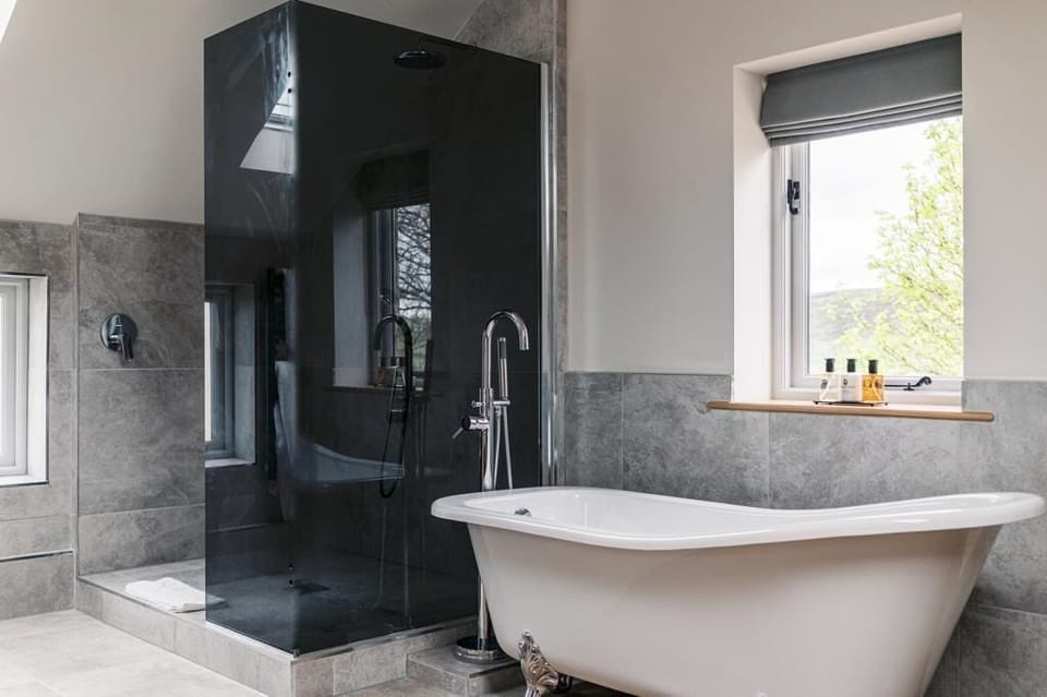Double Room (Hampshire) | Bathroom | Deep soaking tub, rainfall showerhead, hair dryer, bathrobes