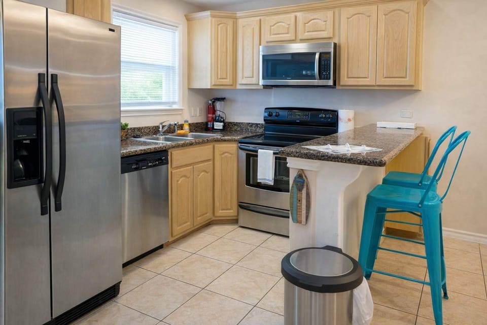 Condo, Multiple Beds, Patio, Pool View | Private kitchen | Fridge, microwave, oven, stovetop