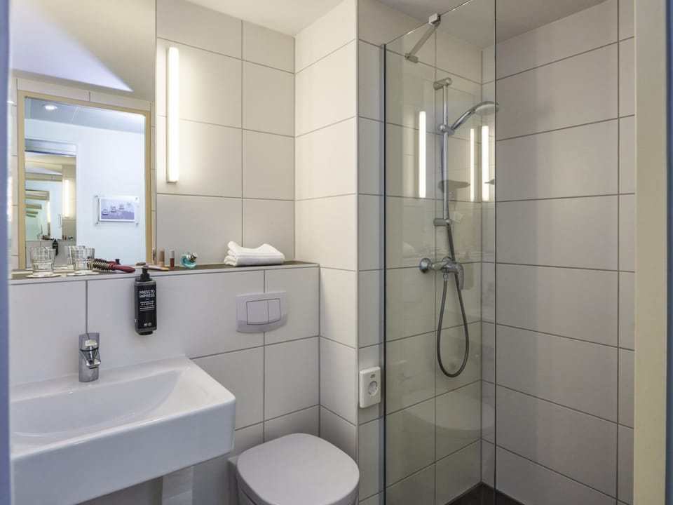 Shower, eco-friendly toiletries, hair dryer, towels