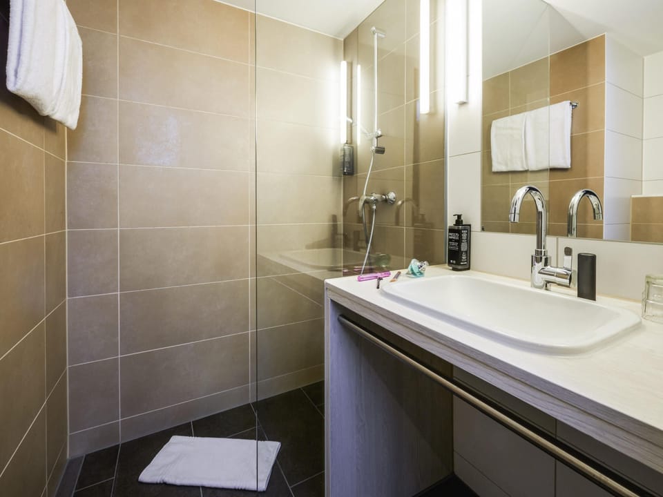Shower, eco-friendly toiletries, hair dryer, towels