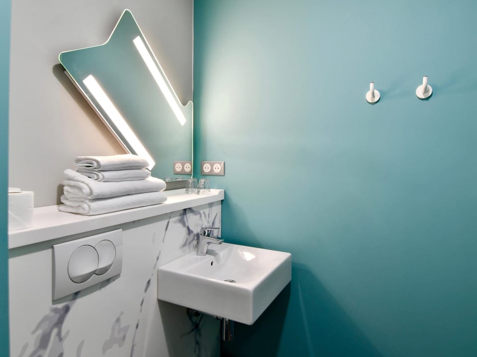 Shower, eco-friendly toiletries, hair dryer, towels