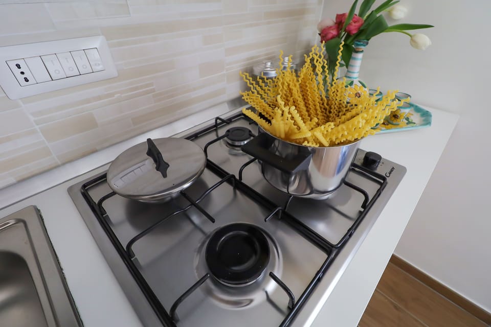 Comfort Apartment | Private kitchen | Full-size fridge, oven, stovetop, espresso maker