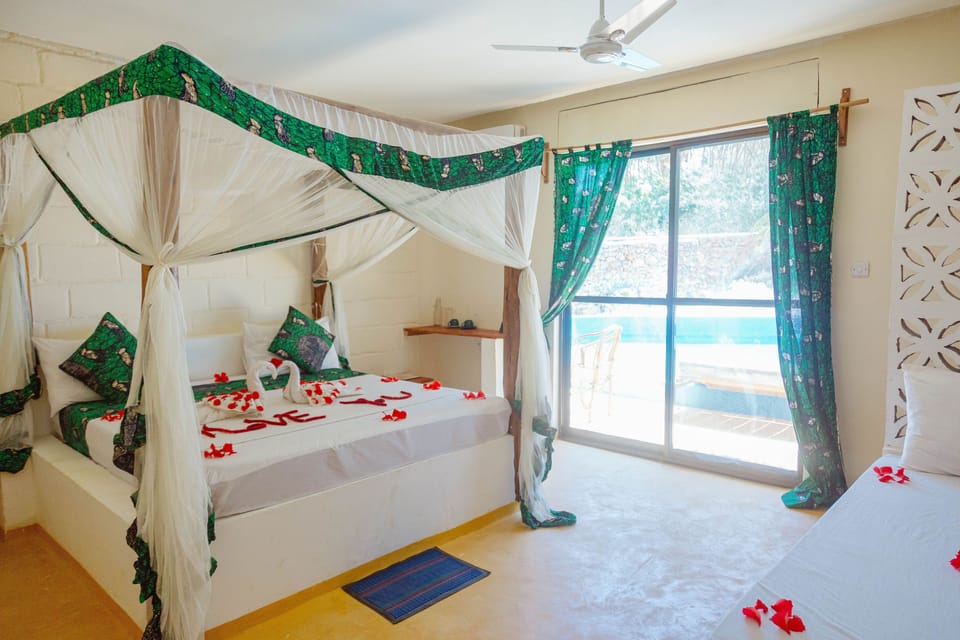 Desk, laptop workspace, iron/ironing board, bed sheets
