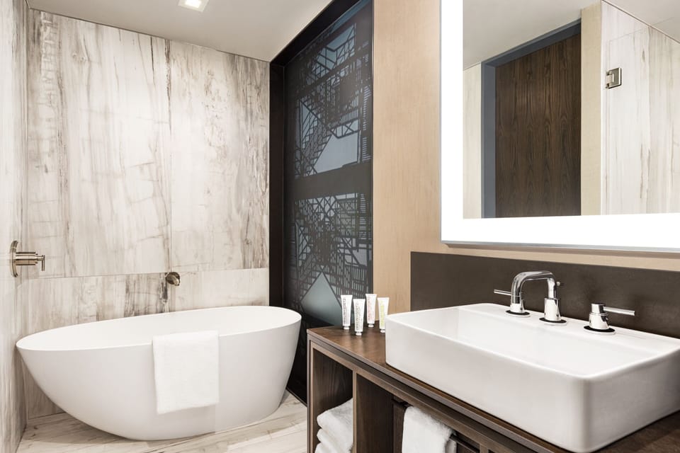 Room, 1 King Bed | Bathroom | Designer toiletries, hair dryer, towels, soap