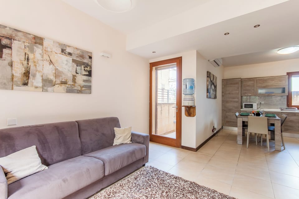 Family House, Multiple Bedrooms, 2 Bathrooms (Getaway Npetto Gozitan Villa) | Living area | 21-inch Smart TV with cable channels