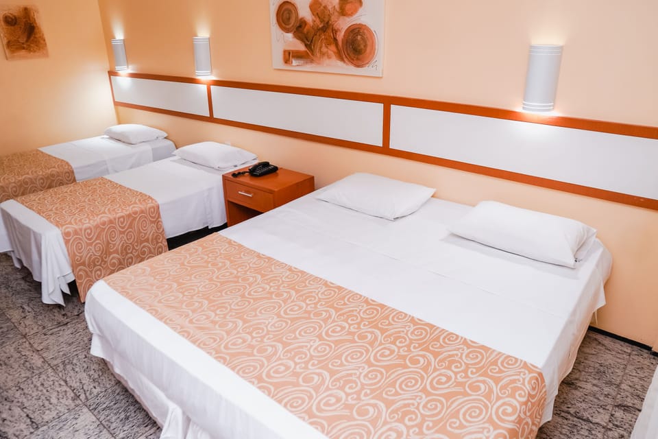 Family Quadruple Room | Minibar, in-room safe, desk, blackout drapes