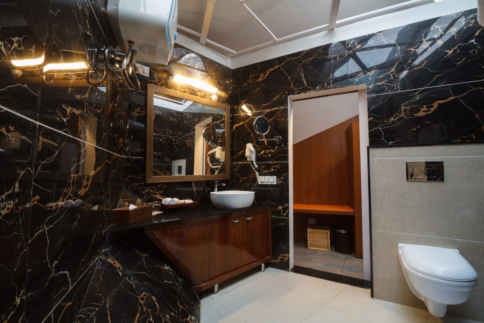 Shower, rainfall showerhead, designer toiletries, hair dryer