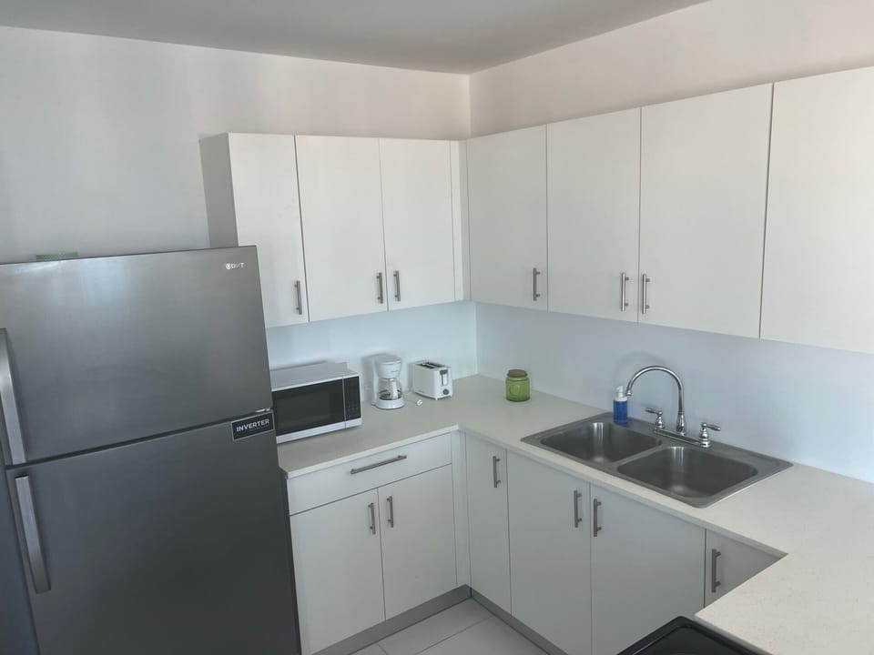 Fridge, microwave, cookware/dishes/utensils