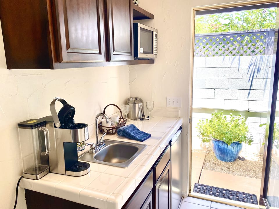 Suite, 1 King Bed, Pool View | Private kitchenette | Fridge, microwave, coffee/tea maker, toaster