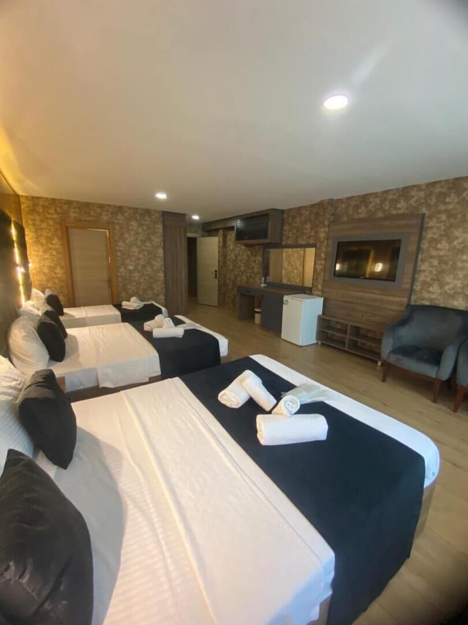 Premium bedding, desk, laptop workspace, soundproofing