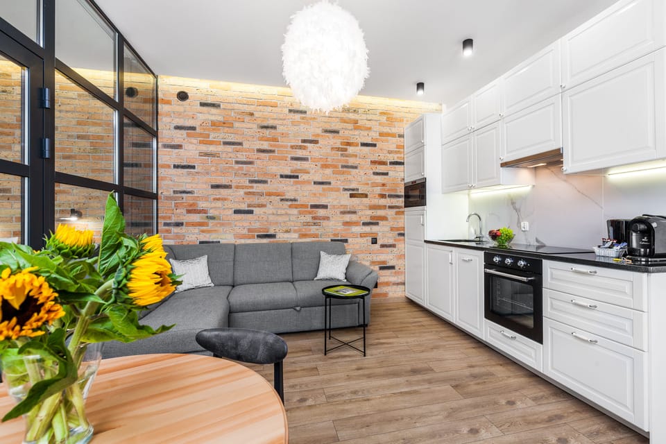 Comfort Apartment | Living area | 42-inch flat-screen TV with cable channels, TV