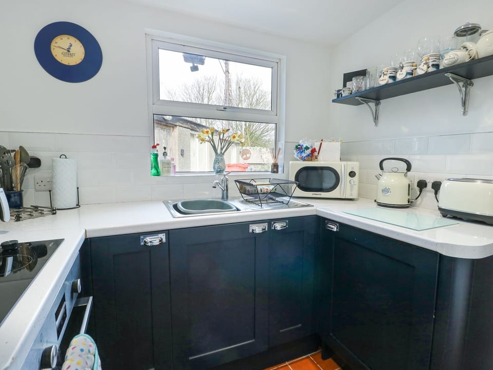 Fridge, electric kettle, toaster, cookware/dishes/utensils