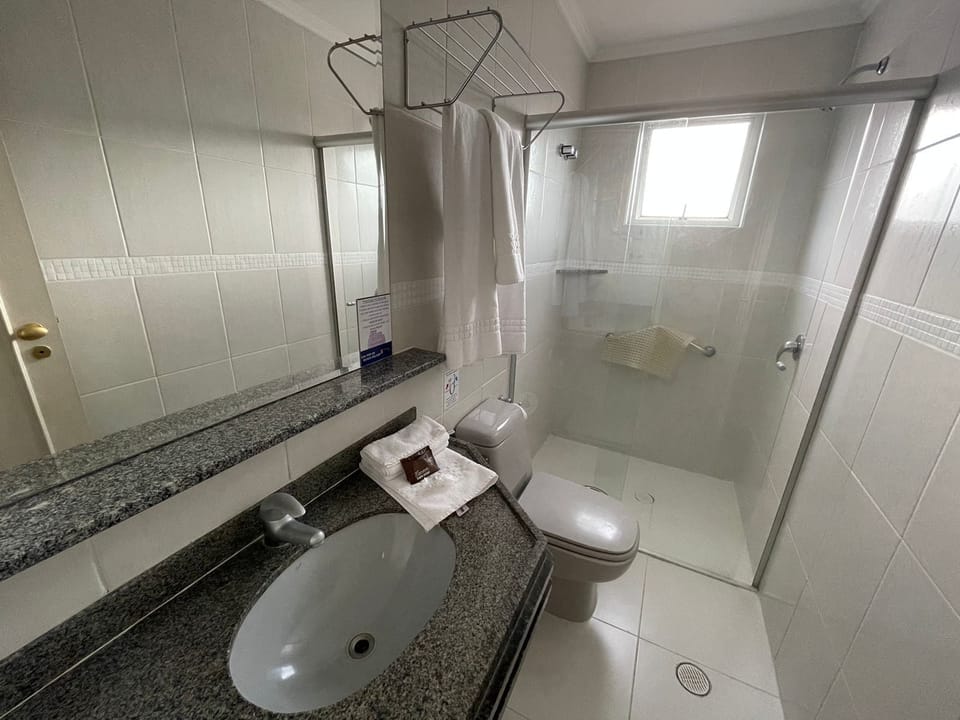 Shower, hair dryer, towels, toilet paper