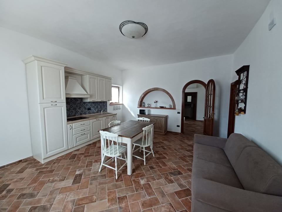 Family Apartment, Patio, Hill View | Living area | 32-inch LED TV with satellite channels, TV