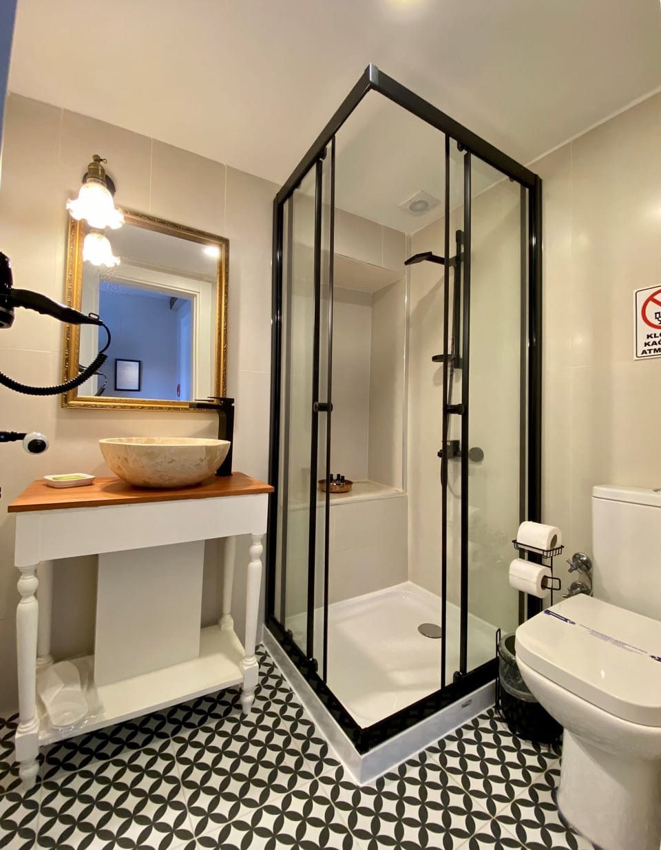 Shower, designer toiletries, hair dryer, slippers