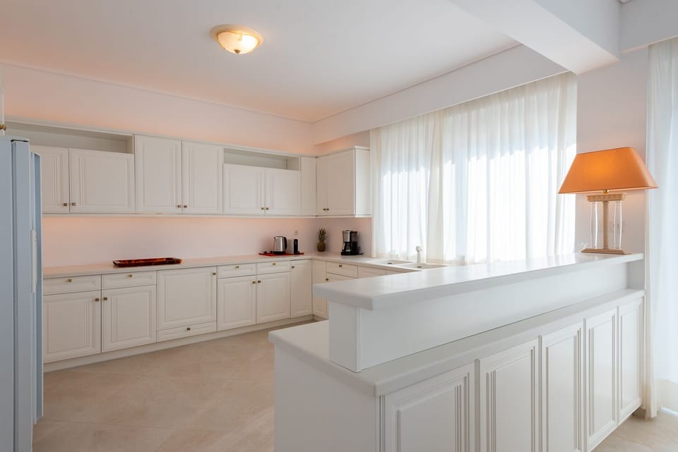 Villa | Private kitchen | Espresso maker, coffee/tea maker, electric kettle, highchair