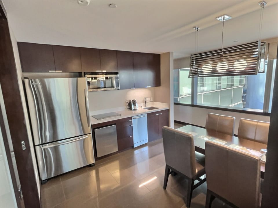 Microwave, stovetop, dishwasher, dining tables