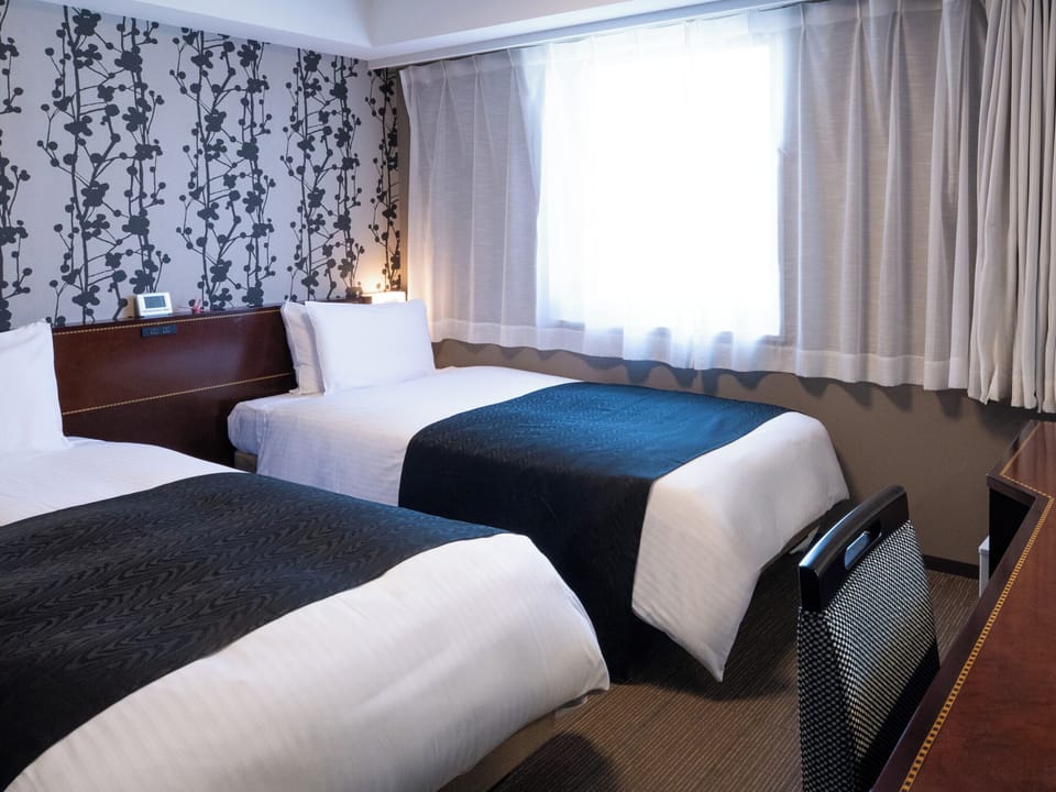 Twin Room, Non Smoking | Down comforters, desk, laptop workspace, blackout drapes