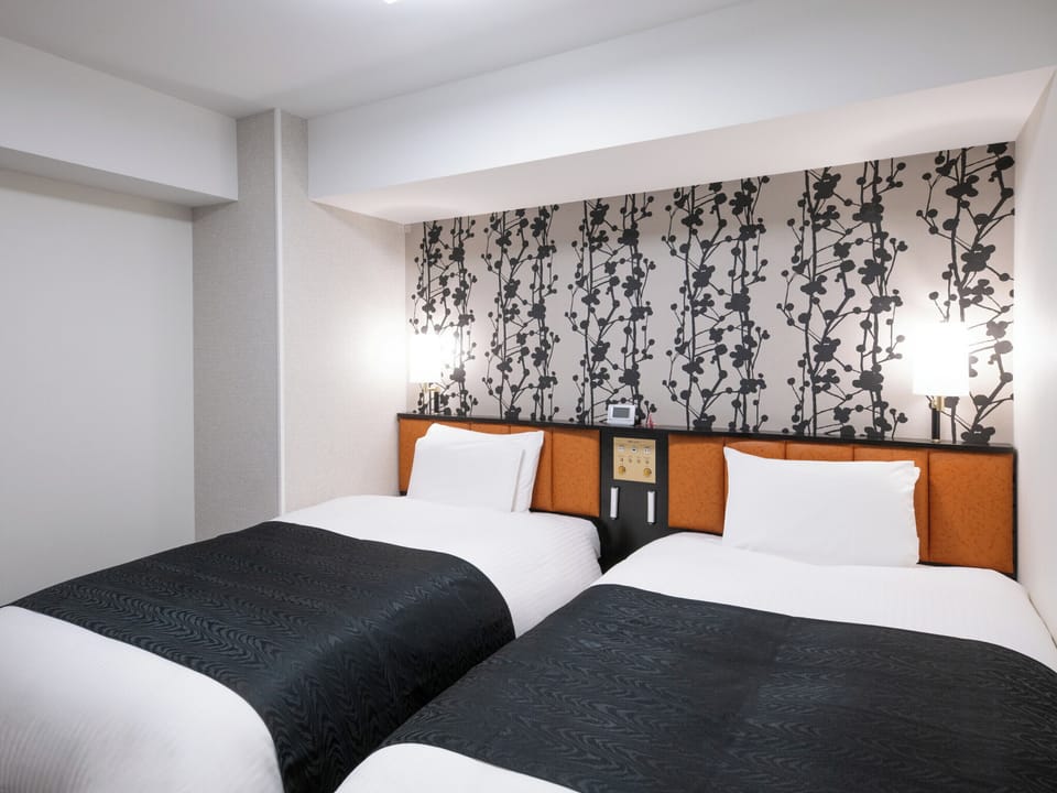 Twin Room, Non Smoking | Down comforters, desk, free wired internet