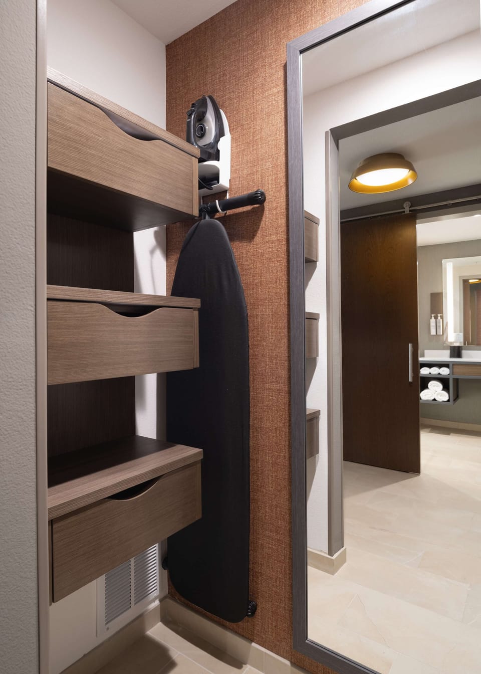 Desk, laptop workspace, iron/ironing board, bed sheets