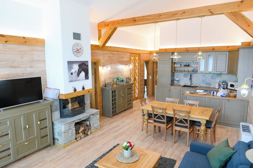 Deluxe Chalet, 3 Bedrooms, Sauna, Mountain View | Living area | 100-cm TV with satellite channels, fireplace