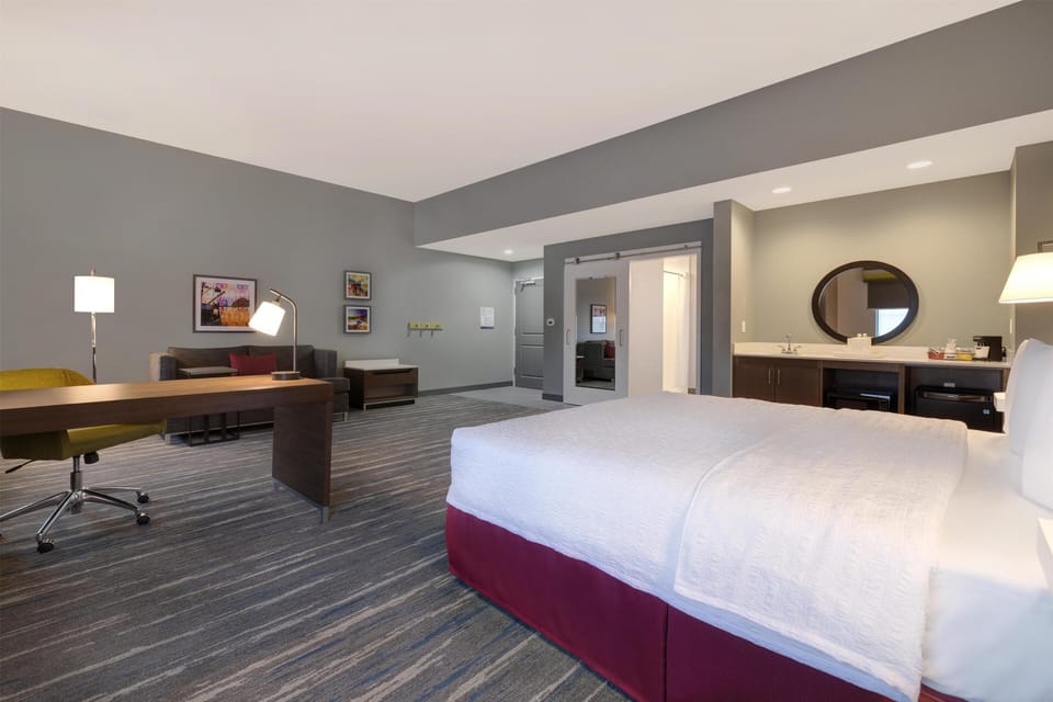 Basic Studio, 1 King Bed (Roll-In Shower) | Living area | 55-inch flat-screen TV with satellite channels, TV