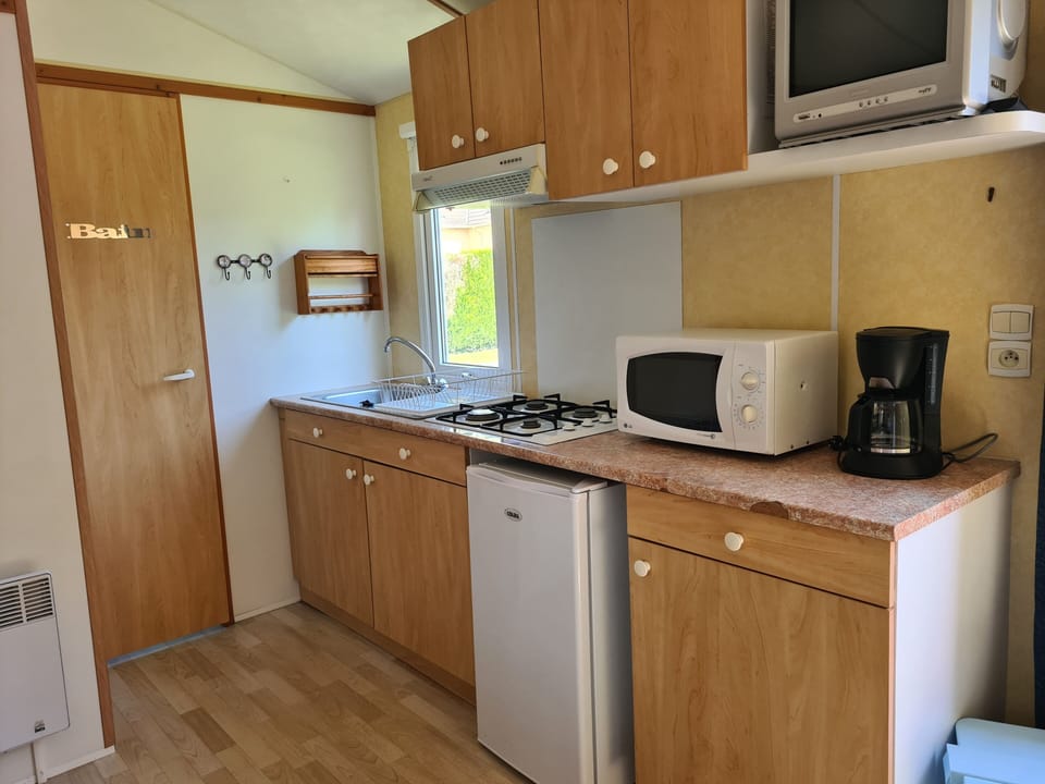 Mini-fridge, microwave, eco-friendly cleaning products, paper towels