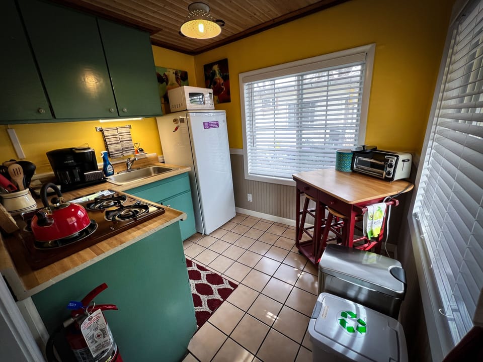 Deluxe Cottage, 1 bedroom (Cookie's Kitchen Cottage) | Private kitchenette | Fridge, microwave, coffee/tea maker, cleaning supplies
