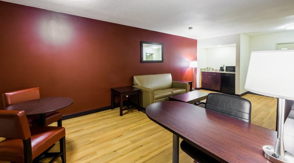 Suite, 1 King Bed (Smoke Free) | Desk, laptop workspace, blackout drapes, iron/ironing board