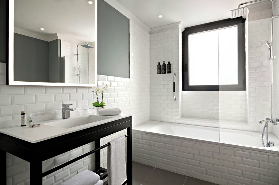 Suite, 1 King Bed with Sofa bed (Studio) | Bathroom | Rainfall showerhead, hair dryer, bidet, towels