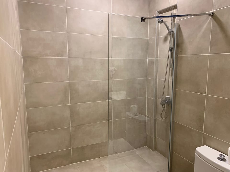 Family Room, Terrace, Pool View | Bathroom | Shower, hair dryer, slippers, towels