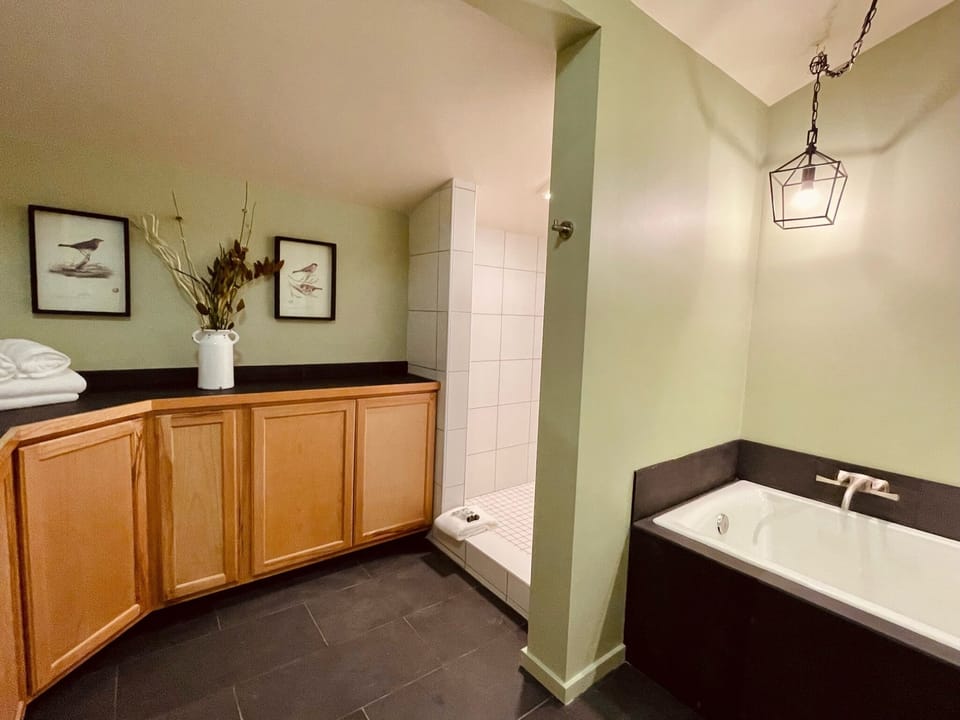 Deluxe Studio Suite, Multiple Beds, Balcony, Mountain View | Bathroom | Free toiletries, hair dryer, towels, soap