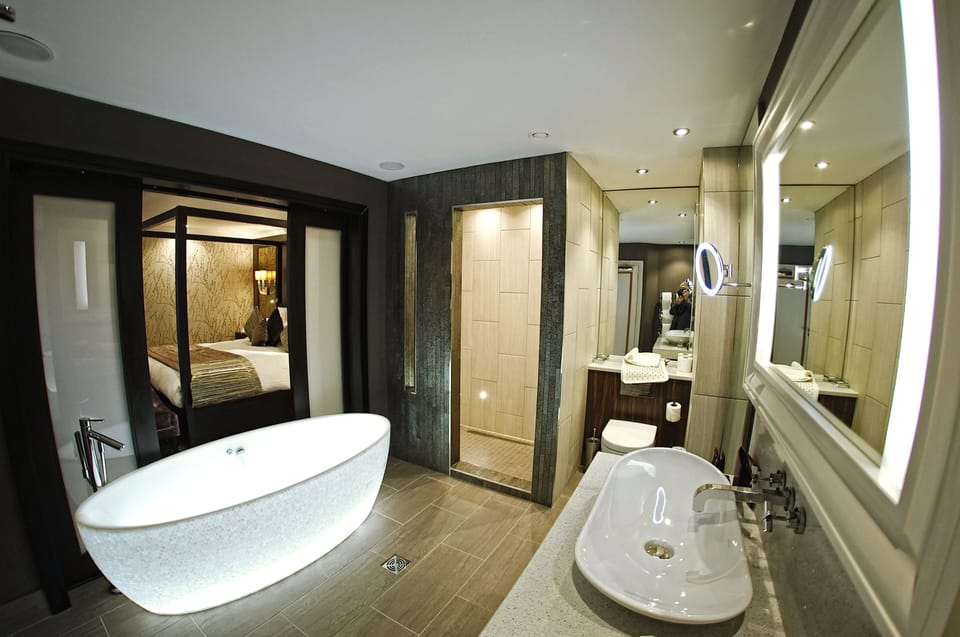 Superior Double Room | Bathroom | Designer toiletries, hair dryer, slippers, towels