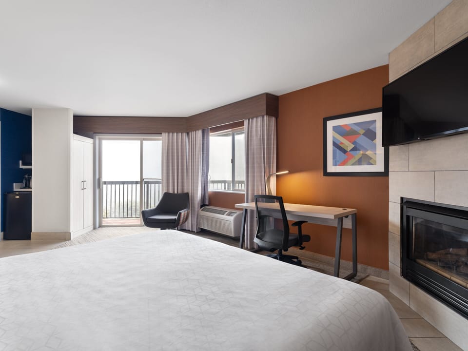 Suite, 1 King Bed, Accessible, Balcony (Communications) | In-room safe, desk, blackout drapes, iron/ironing board