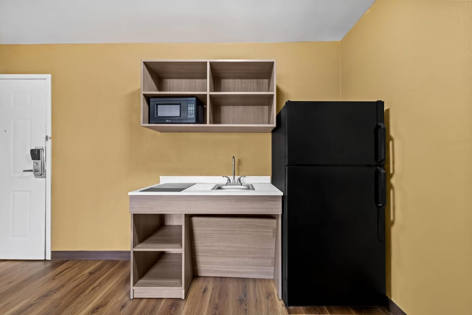 Desk, laptop workspace, blackout drapes, iron/ironing board
