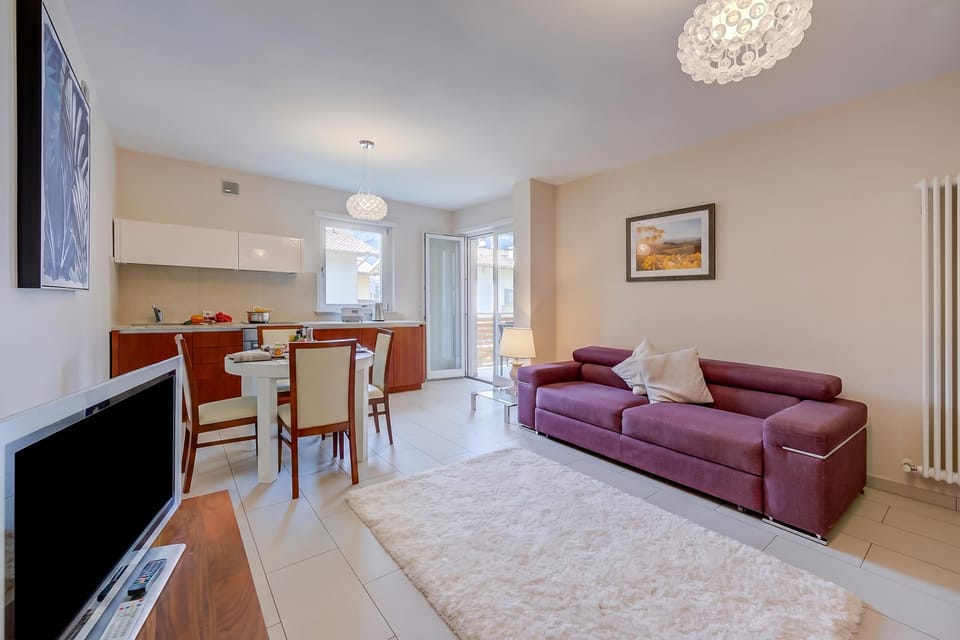 Family Apartment, Multiple Bedrooms (Casa Margherita Few Minutes From Lake) | Living area | 21-inch flat-screen TV with cable channels, TV