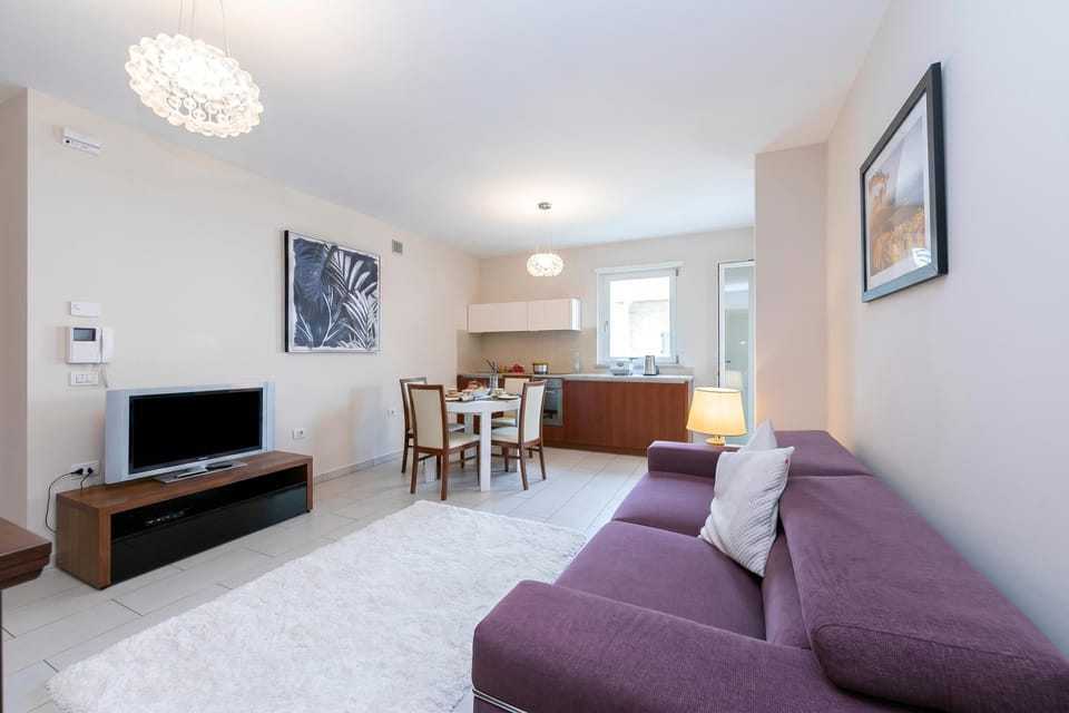 Family Apartment, Multiple Bedrooms (Casa Margherita Few Minutes From Lake) | Living area | 21-inch flat-screen TV with cable channels, TV