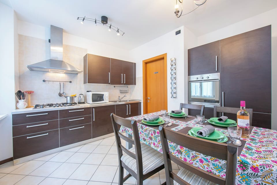 Family Apartment, Multiple Bedrooms (Casa Azzurra 150m From Lake) | Private kitchen | Fridge, microwave, oven, stovetop