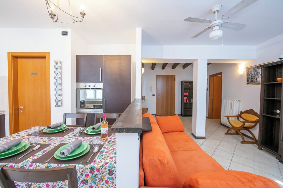 Family Apartment, Multiple Bedrooms (Casa Azzurra 150m From Lake) | Living area | 21-inch flat-screen TV with cable channels
