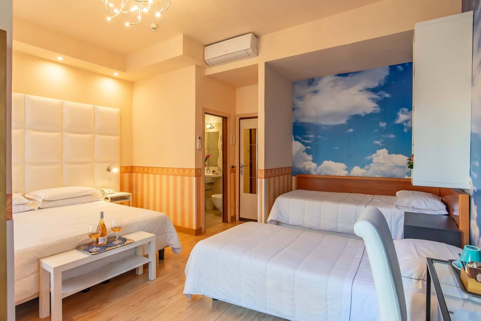 Quadruple Room | Hypo-allergenic bedding available, minibar, in-room safe, desk