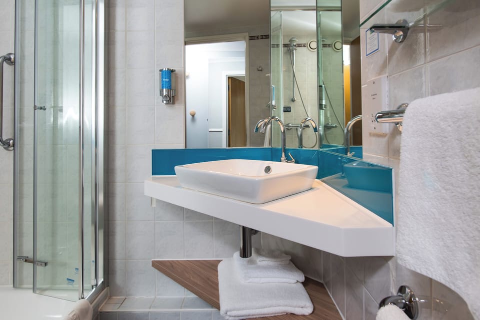 Shower, eco-friendly toiletries, hair dryer, towels