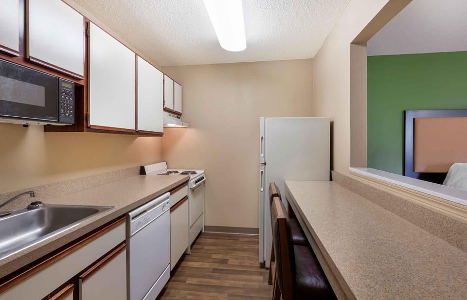 Deluxe Studio, Multiple Beds, Non Smoking | Private kitchen | Coffee/tea maker, full-size fridge, microwave, stovetop