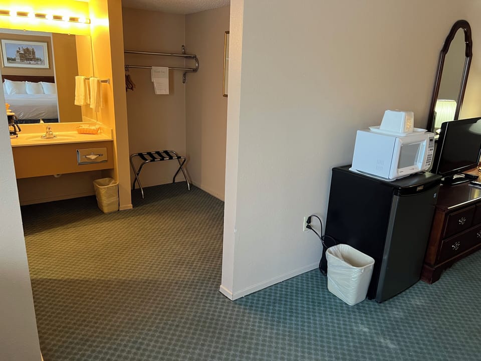 Suite, 1 King Bed, Non Smoking | Bathroom | Hair dryer, towels, soap, shampoo